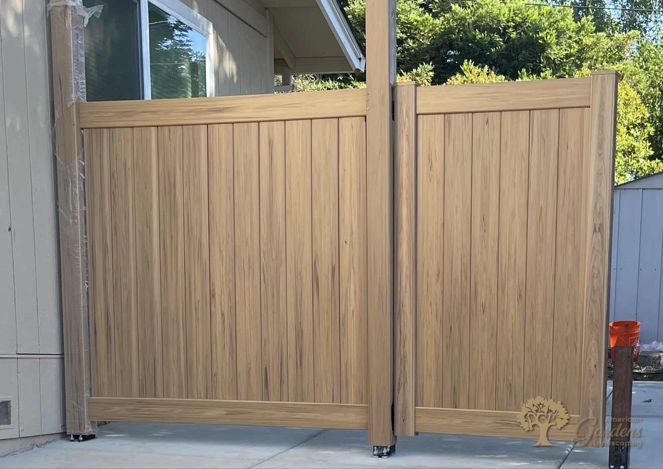 Wood-grain vinyl privacy fence panels installed in Cameron Park