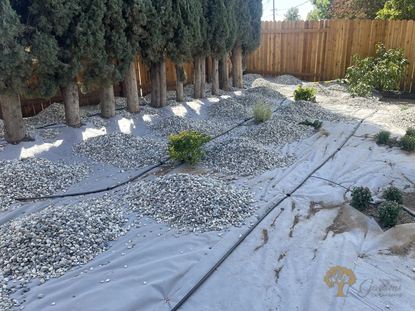 Carmichael Backyard Landscaping – During: Weed Fabric, Gravel and Drip Lines – American Gardens Landscaping