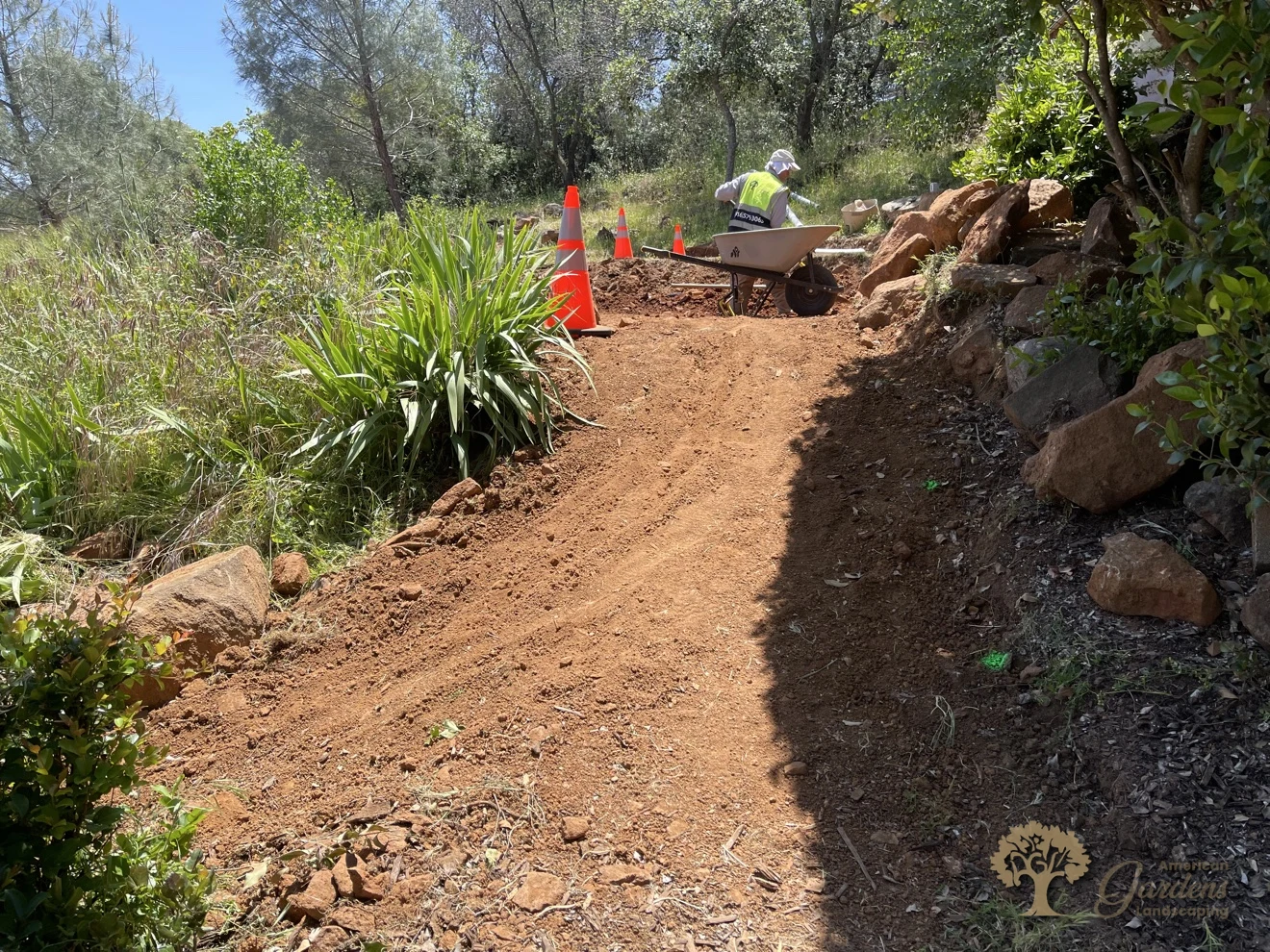Grading a dirt hillside path before building pressure-treated wood steps in Shingle Springs – American Gardens Landscaping
