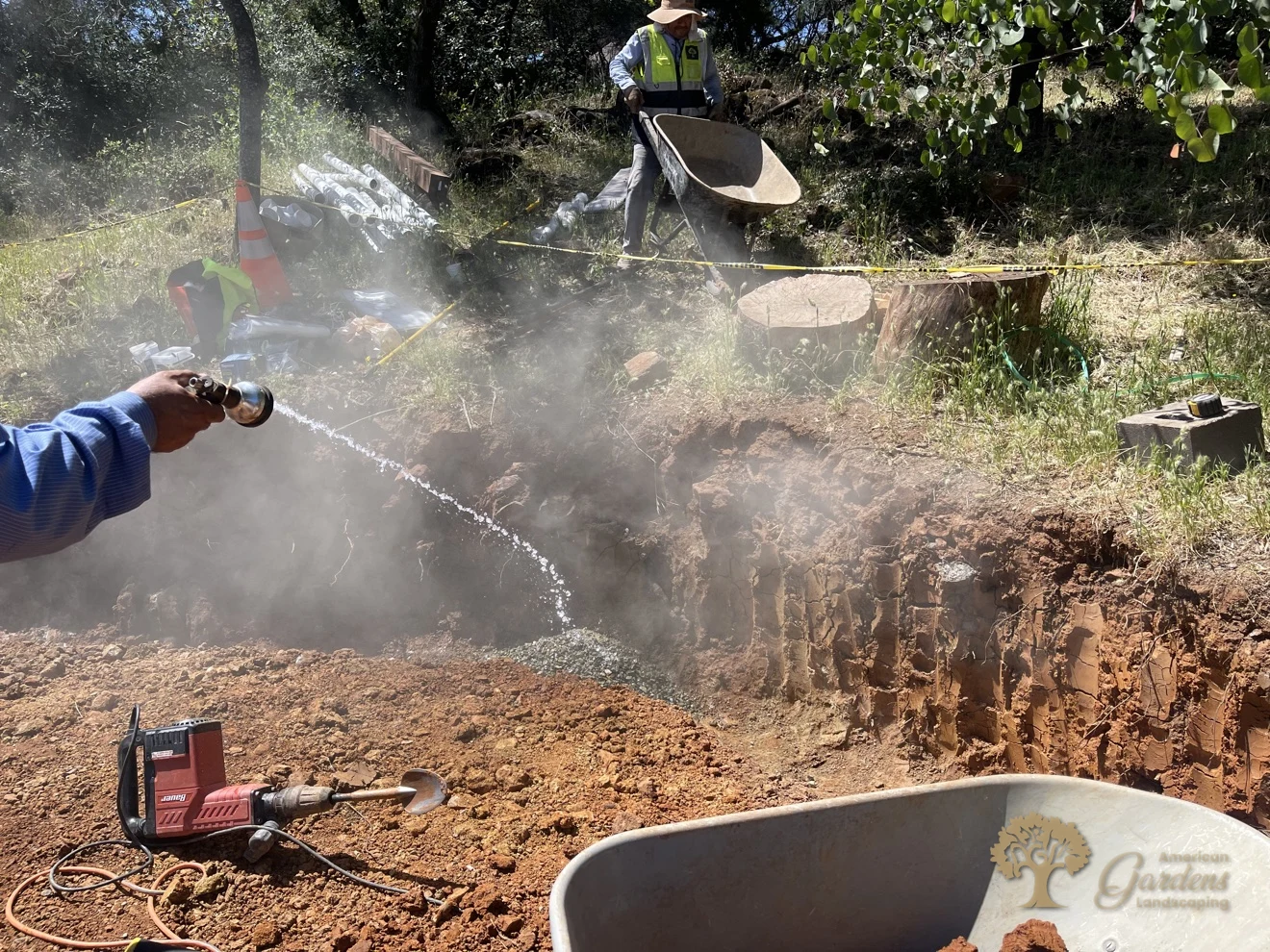 Water sprayed for dust control while hauling soil during a retaining wall excavation in Shingle Springs