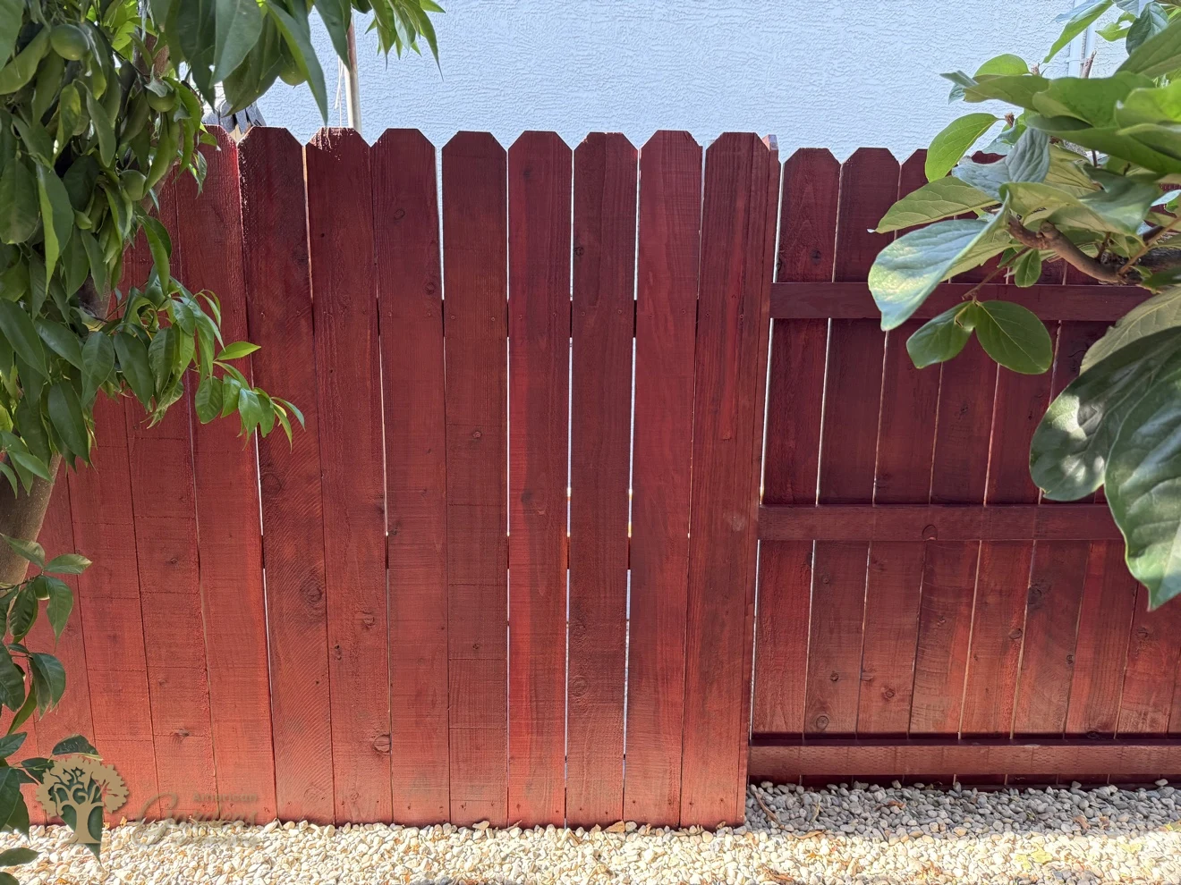Stained redwood fence section in Rocklin – American Gardens Landscaping