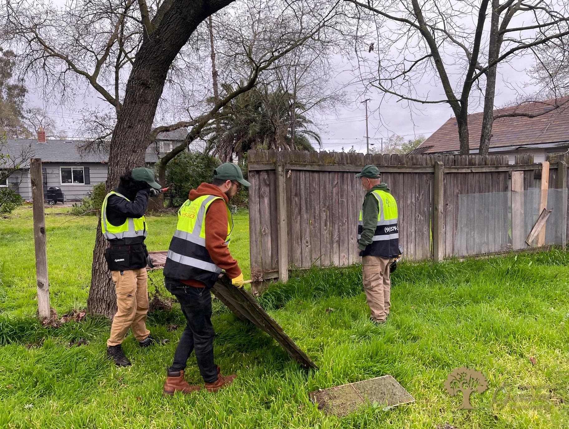 American Gardens Landscaping crew preparing a fence replacement site in Sacramento