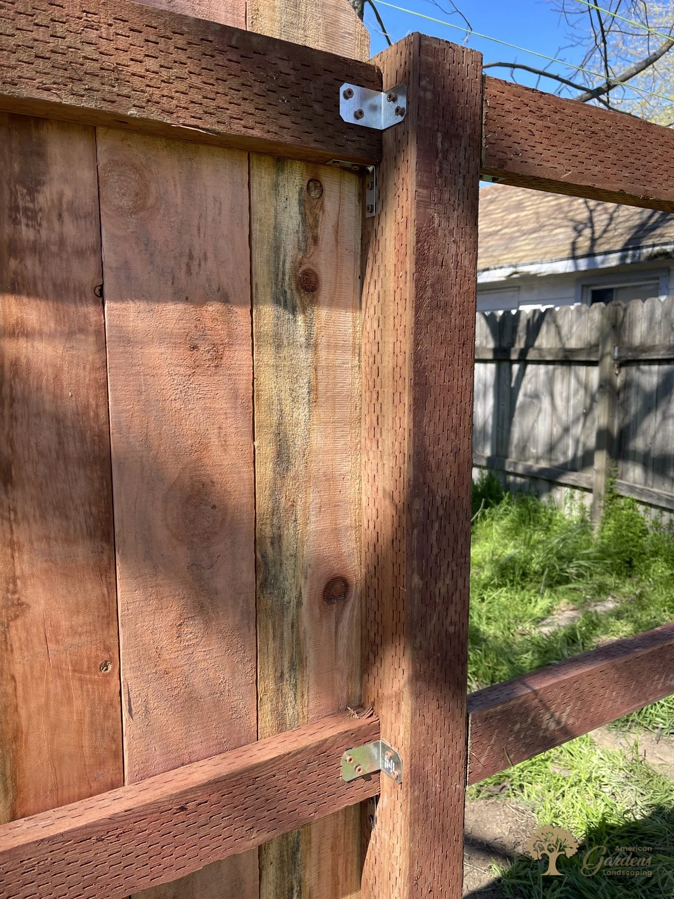 Close-up of redwood fence boards on a custom fence built by American Gardens Landscaping in Sacramento