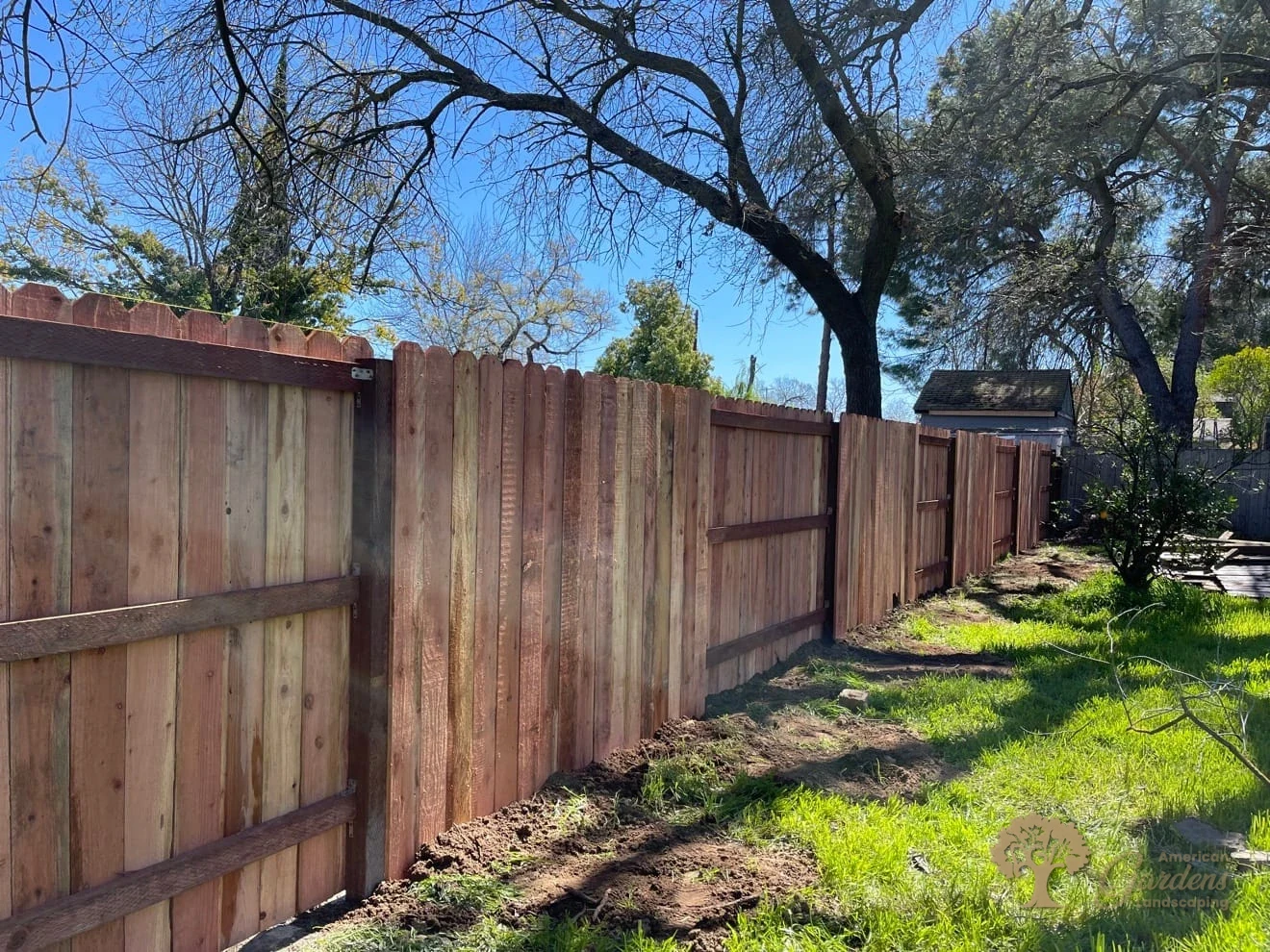 Custom redwood fence installation by American Gardens Landscaping in Sacramento