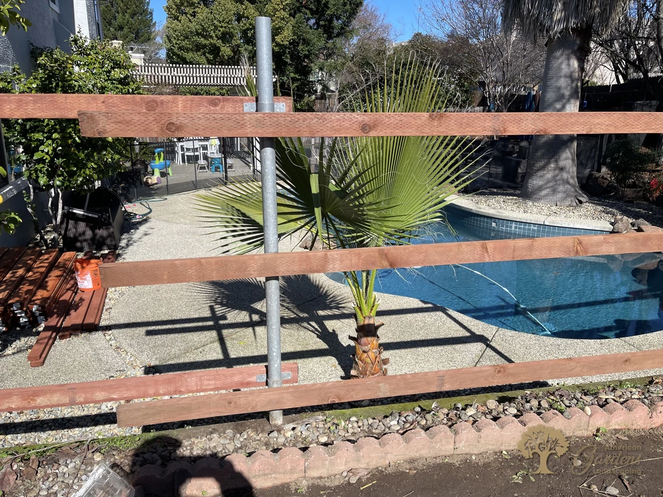 Simpson steel brackets on a galvanized post, redwood fence build in Folsom – American Gardens Landscaping