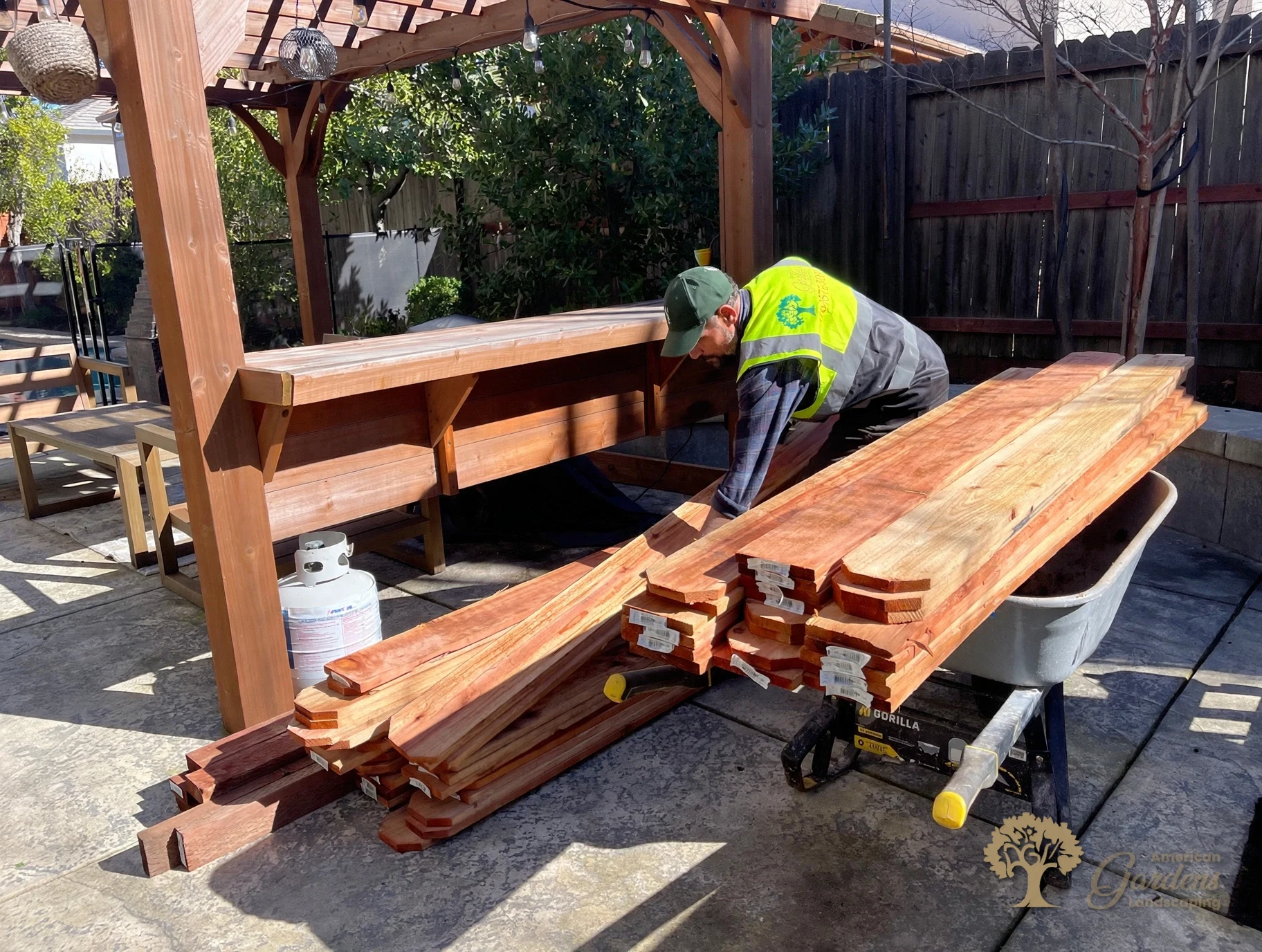 Preparing redwood pickets for a custom fence in Folsom – American Gardens Landscaping