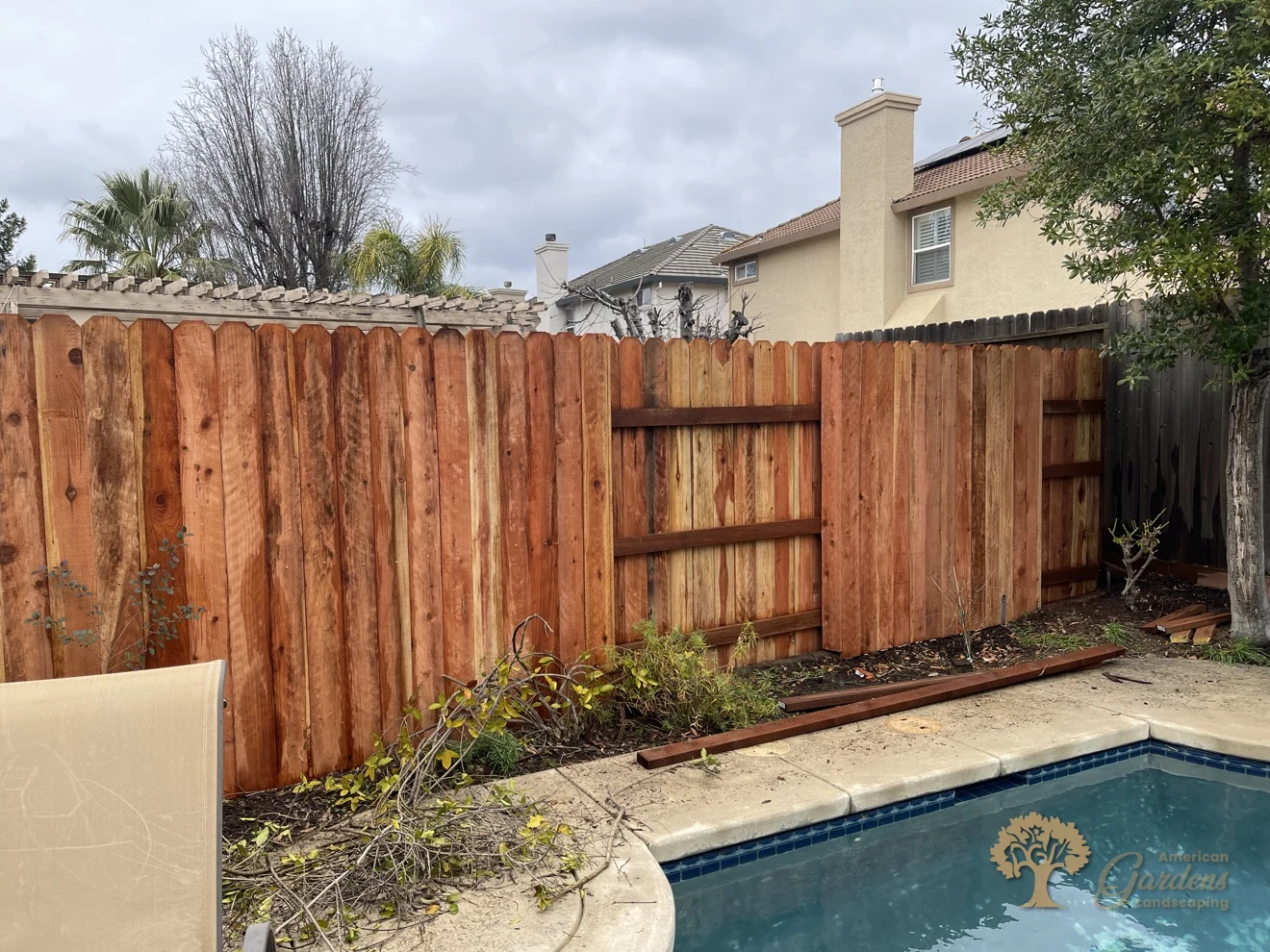 New redwood dog-ear fence beside the pool in Folsom – American Gardens Landscaping