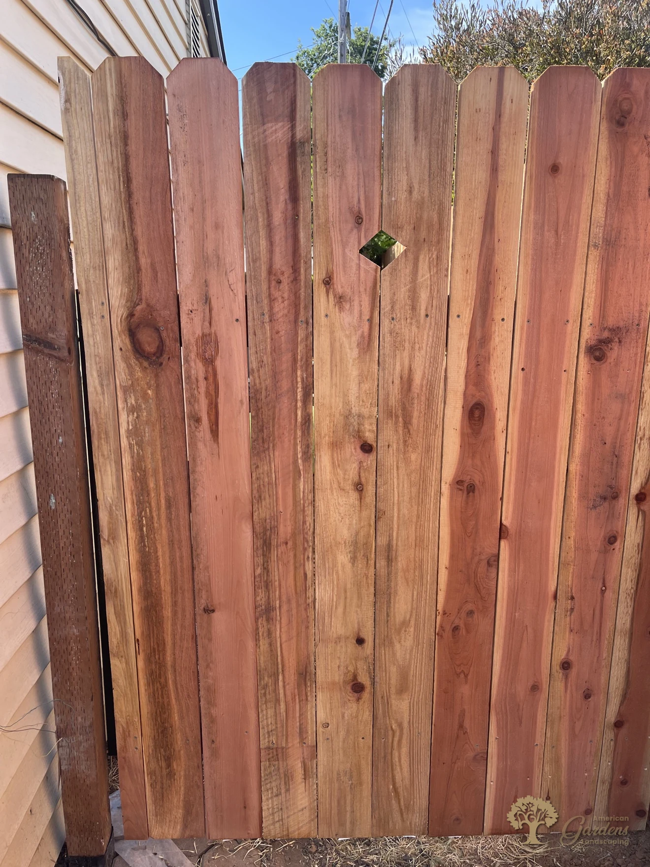 Redwood dog-ear pickets with a decorative diamond cutout in Sacramento – American Gardens Landscaping