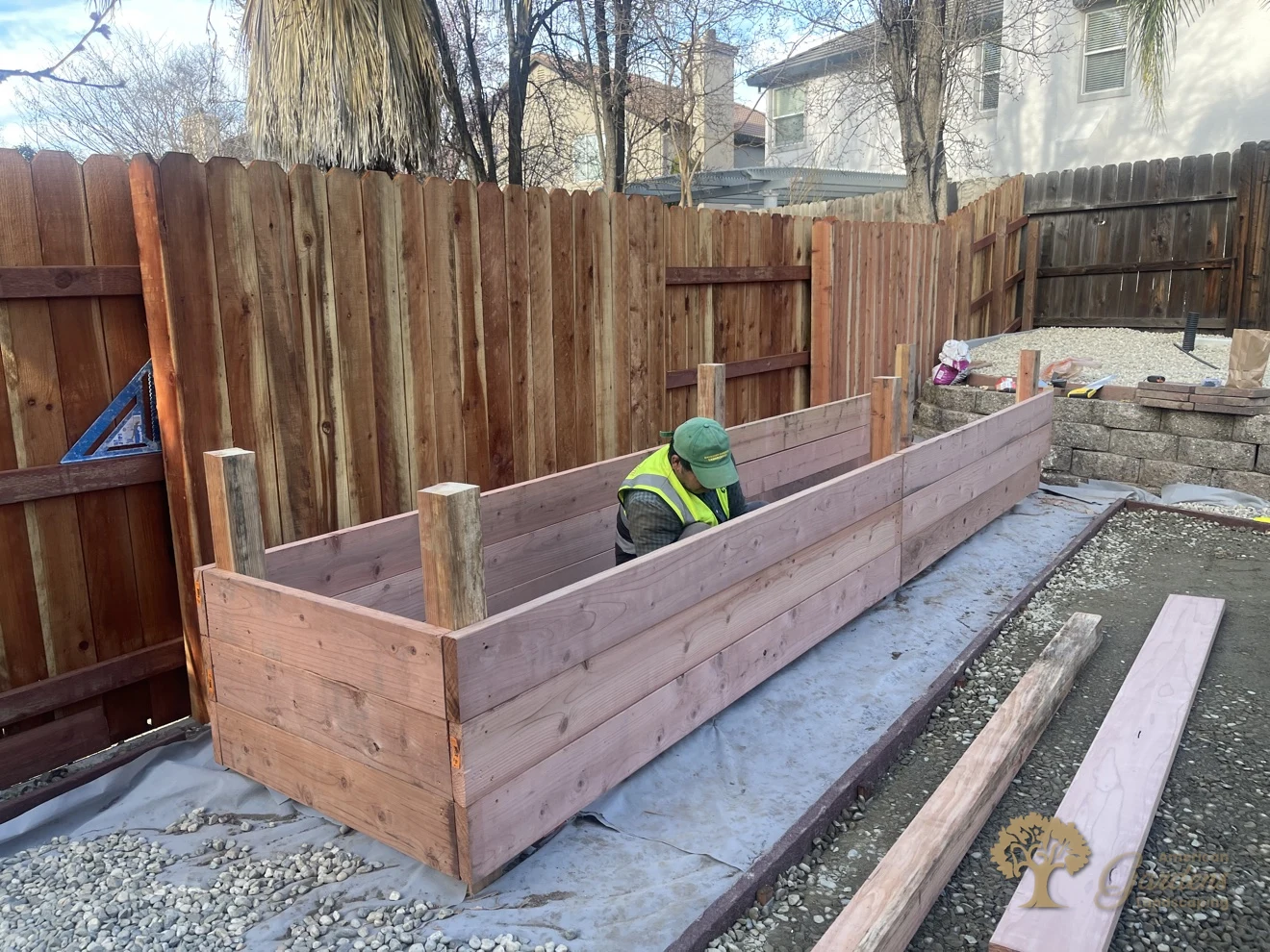 Building the raised planter bed along the new redwood fence in Folsom – American Gardens Landscaping