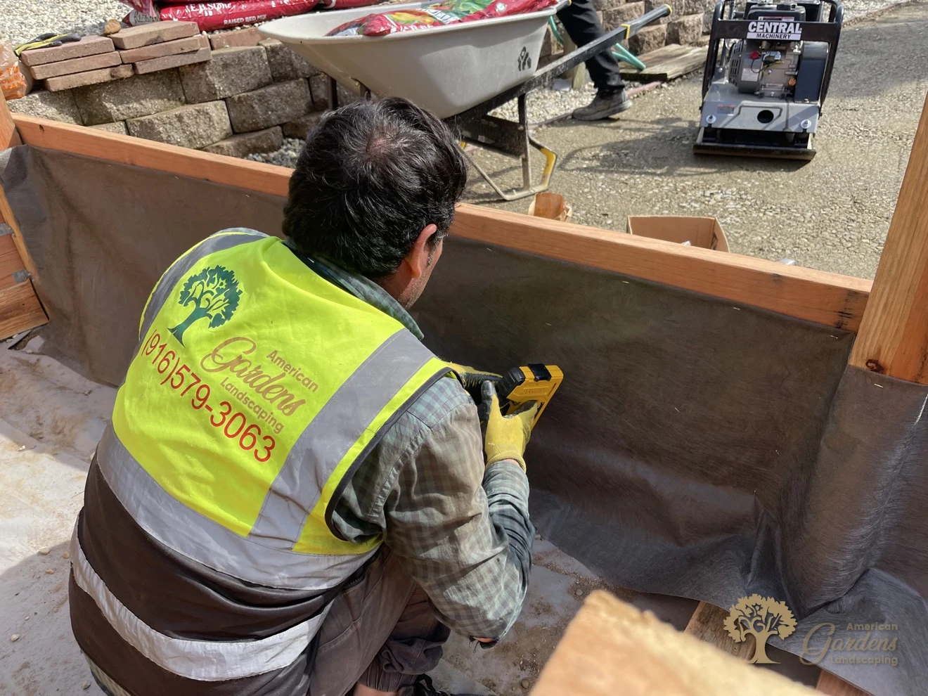 Lining the raised bed with fabric — American Gardens crew at work in Folsom – American Gardens Landscaping