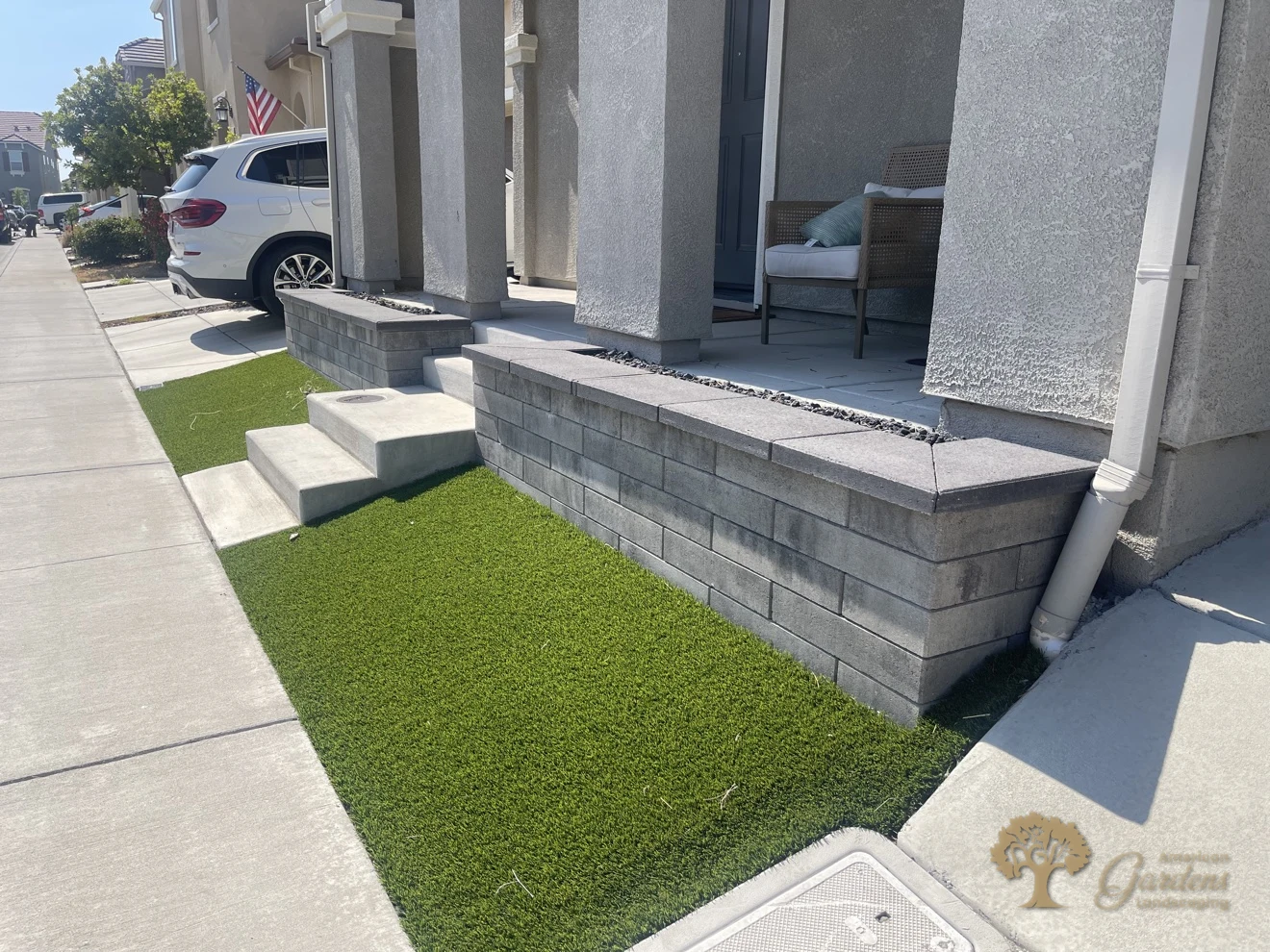 Concrete block retaining wall with capstones, steps and artificial turf in Roseville – American Gardens Landscaping
