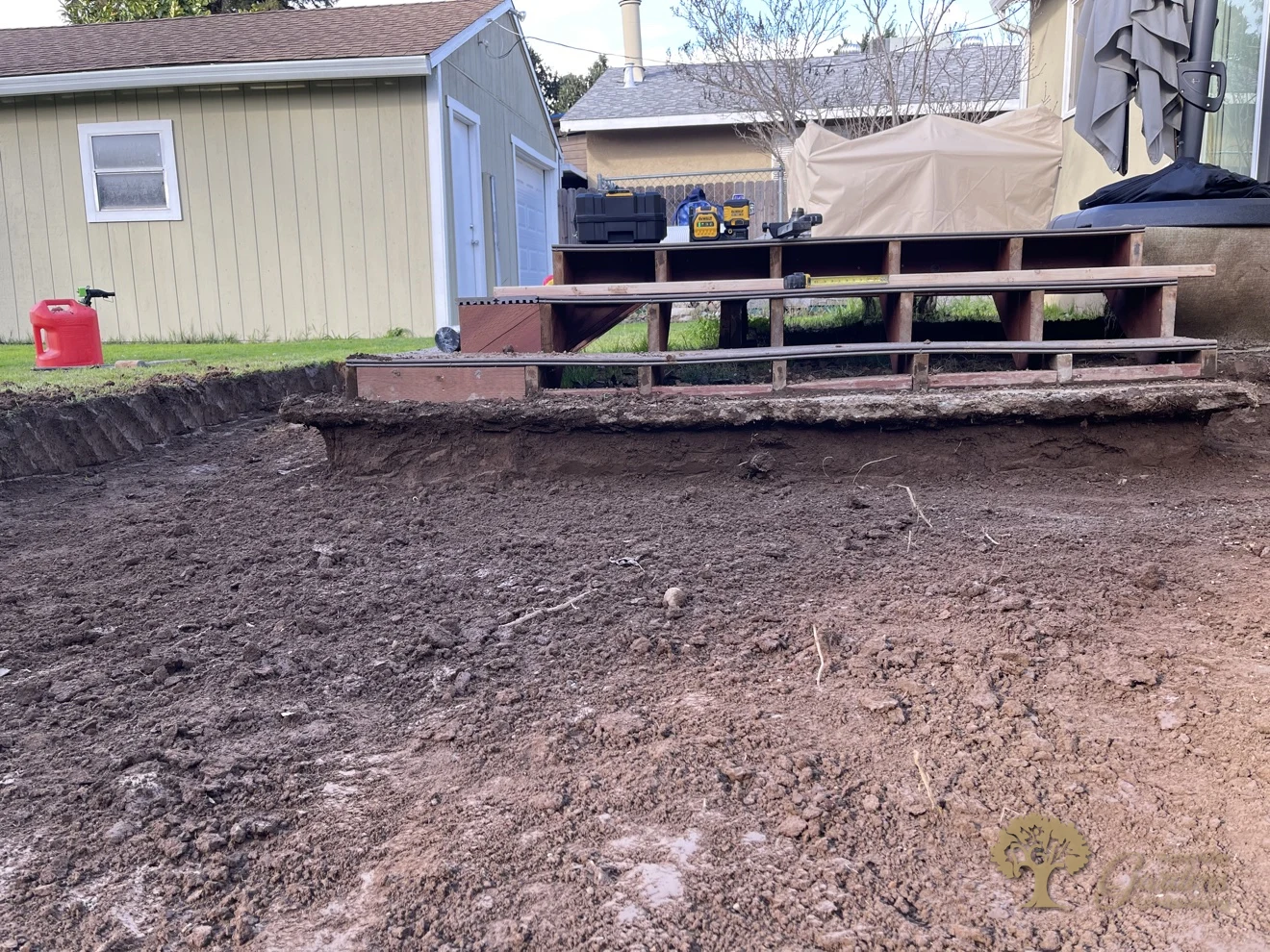 Excavated dirt yard ready for a herringbone paver patio in Sacramento – American Gardens Landscaping