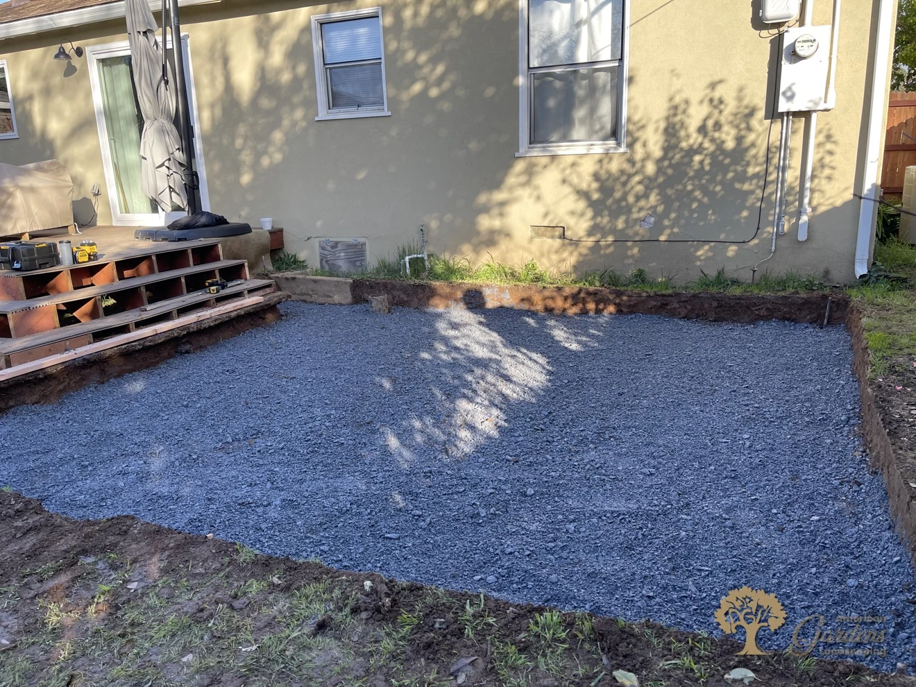 Compacted base rock ready for bedding sand for a herringbone paver patio in Sacramento – American Gardens Landscaping