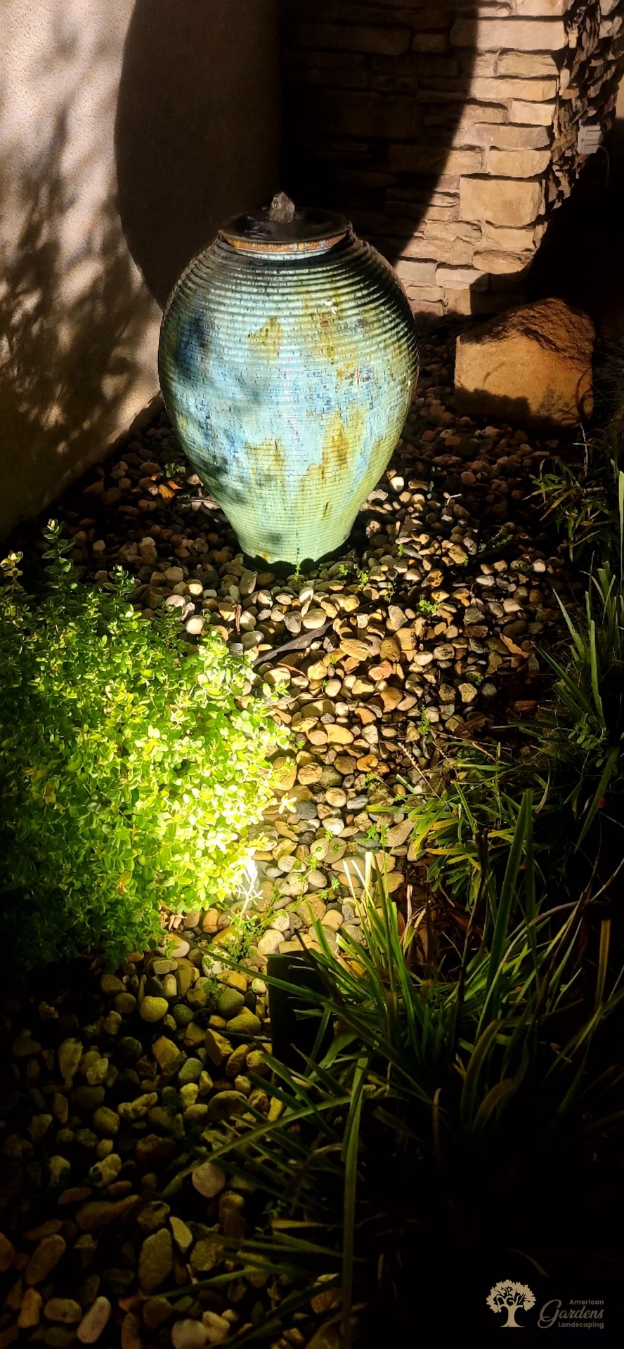 Uplighting on a garden urn fountain in Roseville – American Gardens Landscaping