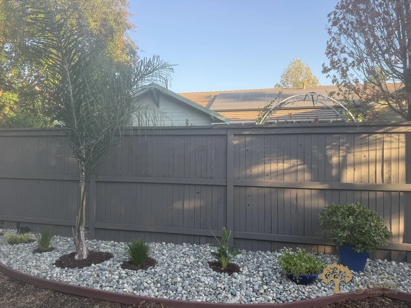 Finished tropical planting with river rock mulch in Natomas, Sacramento – American Gardens Landscaping