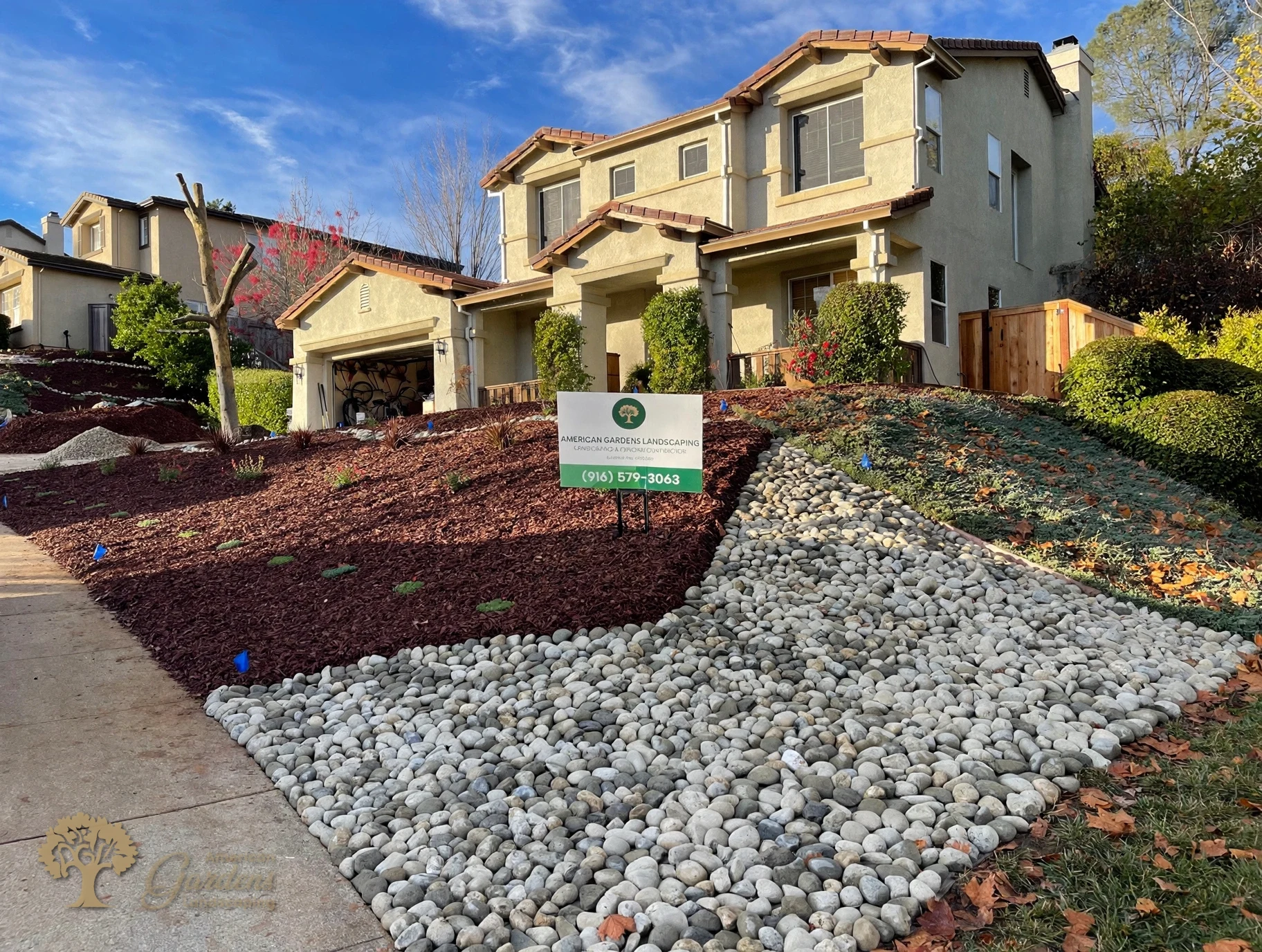 Finished front yard xeriscape with river-rock drainage in El Dorado Hills – American Gardens Landscaping