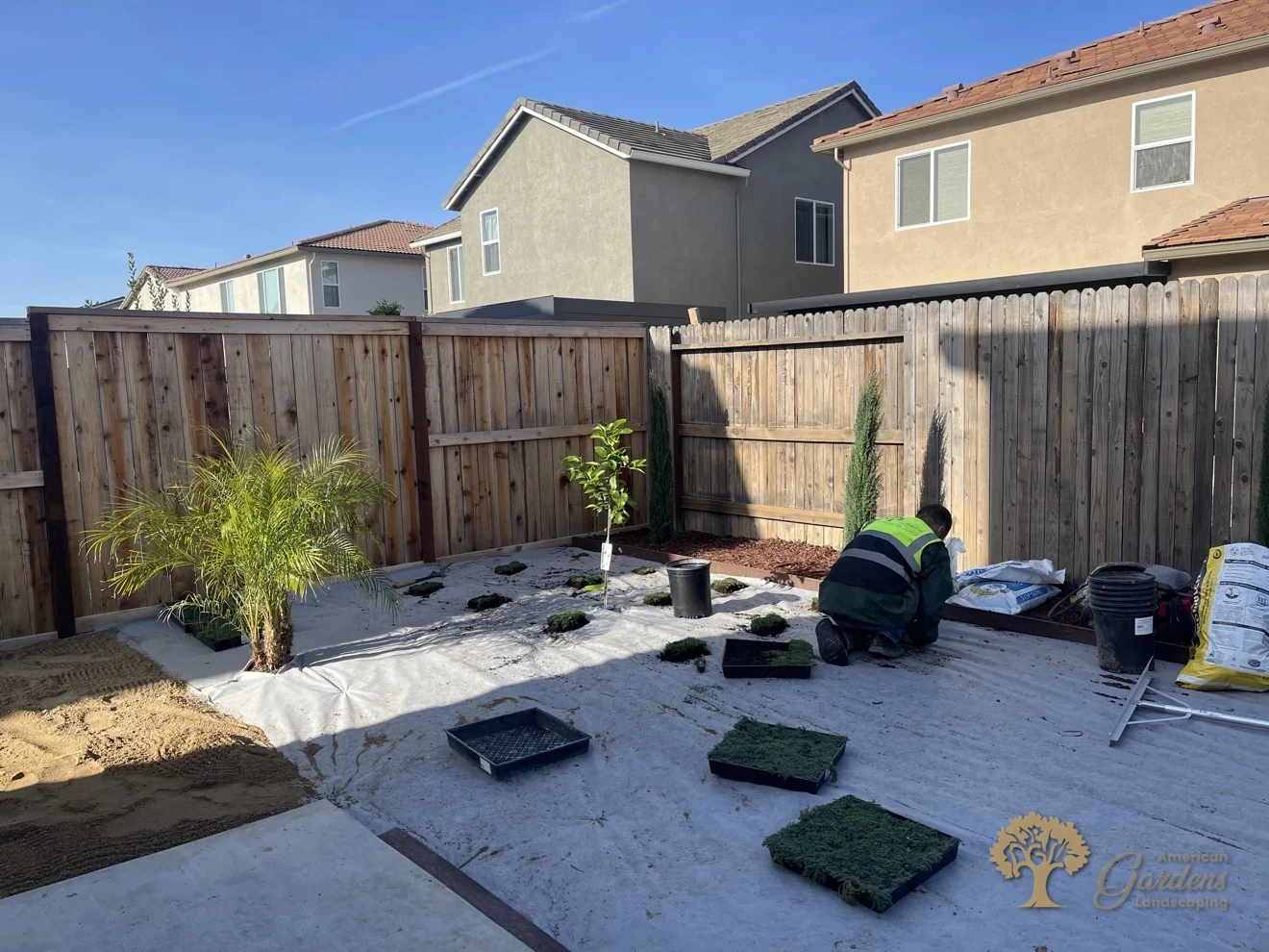 Crew planting the groundcover grid in Lincoln – American Gardens Landscaping