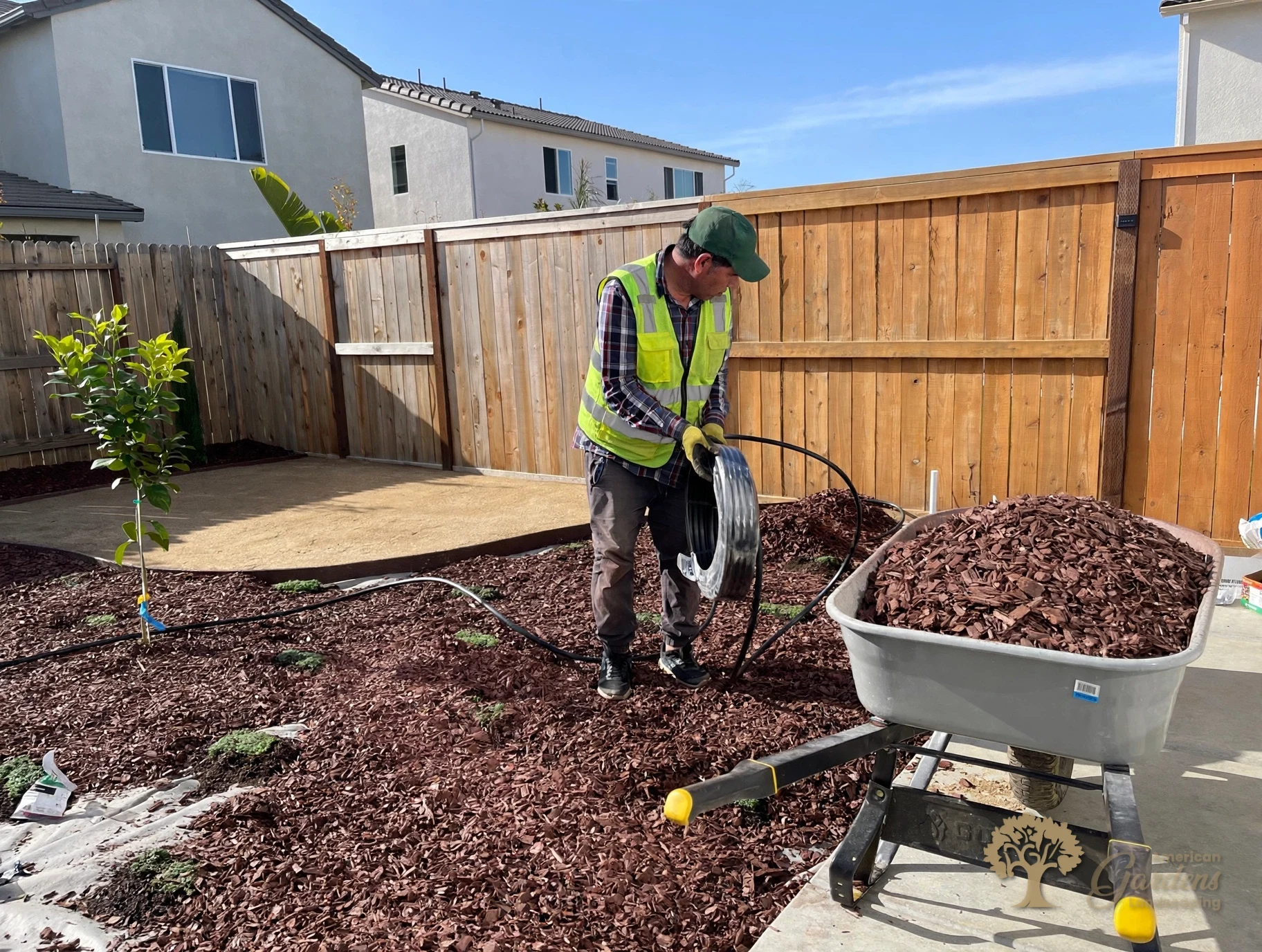 Running drip line through the bark in Lincoln – American Gardens Landscaping